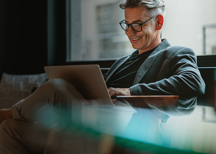 Man in a suit on a laptop
